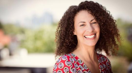 Woman smiling outside